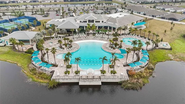 an aerial view of a house with a big yard