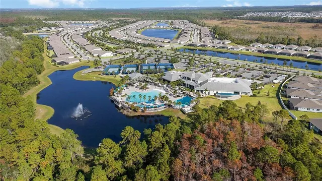 an aerial view of multiple houses with yard