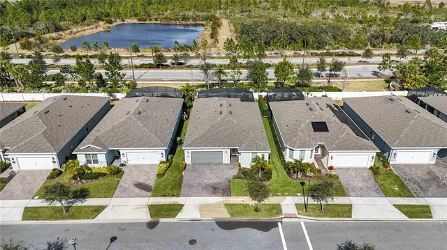 an aerial view of houses with outdoor space