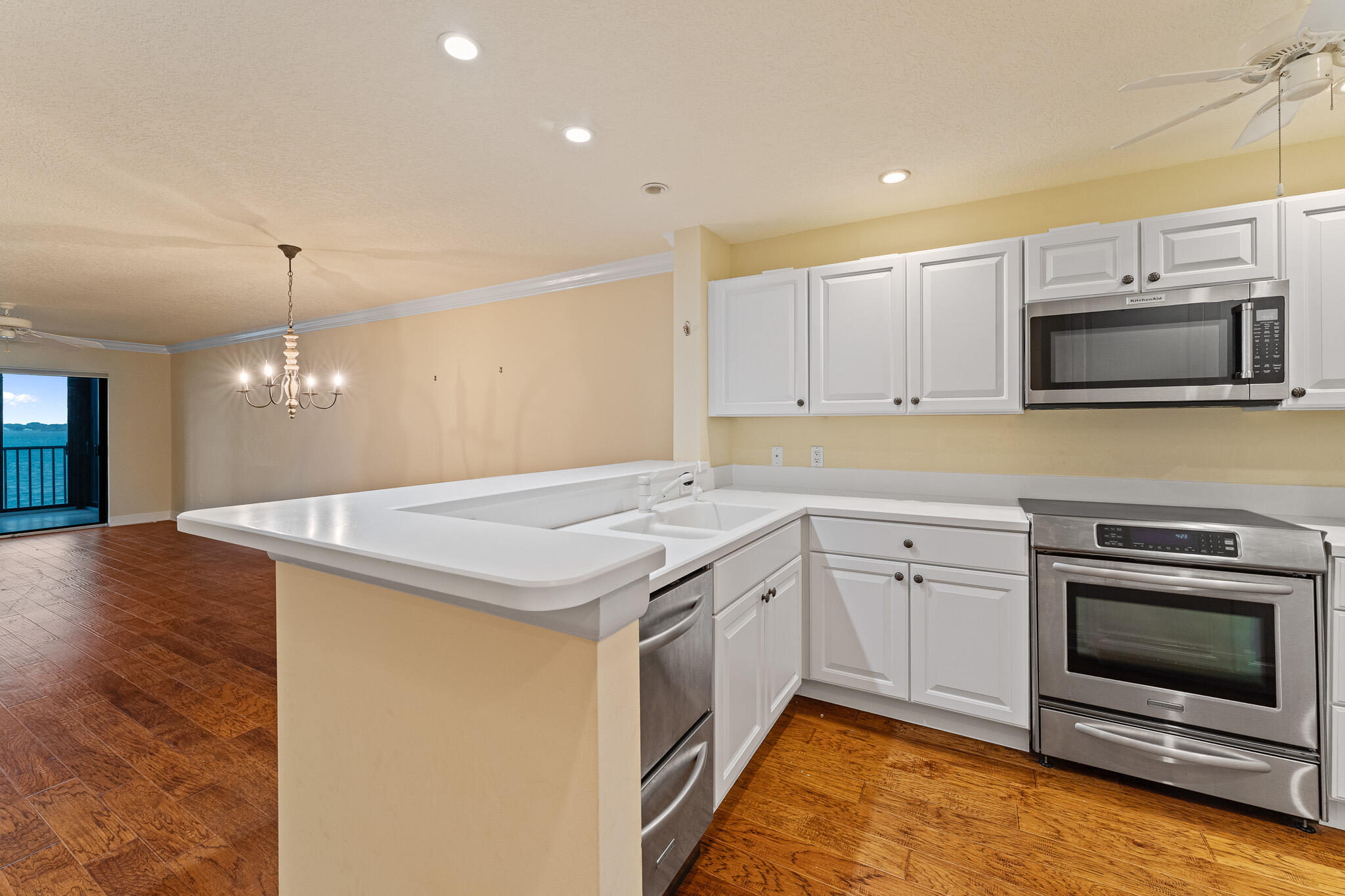 10 Northeast Plantation Road, Unit 305 Jensen Beach, FL 34957 - Photo 13 of 48 a kitchen with a stove and a microwave
