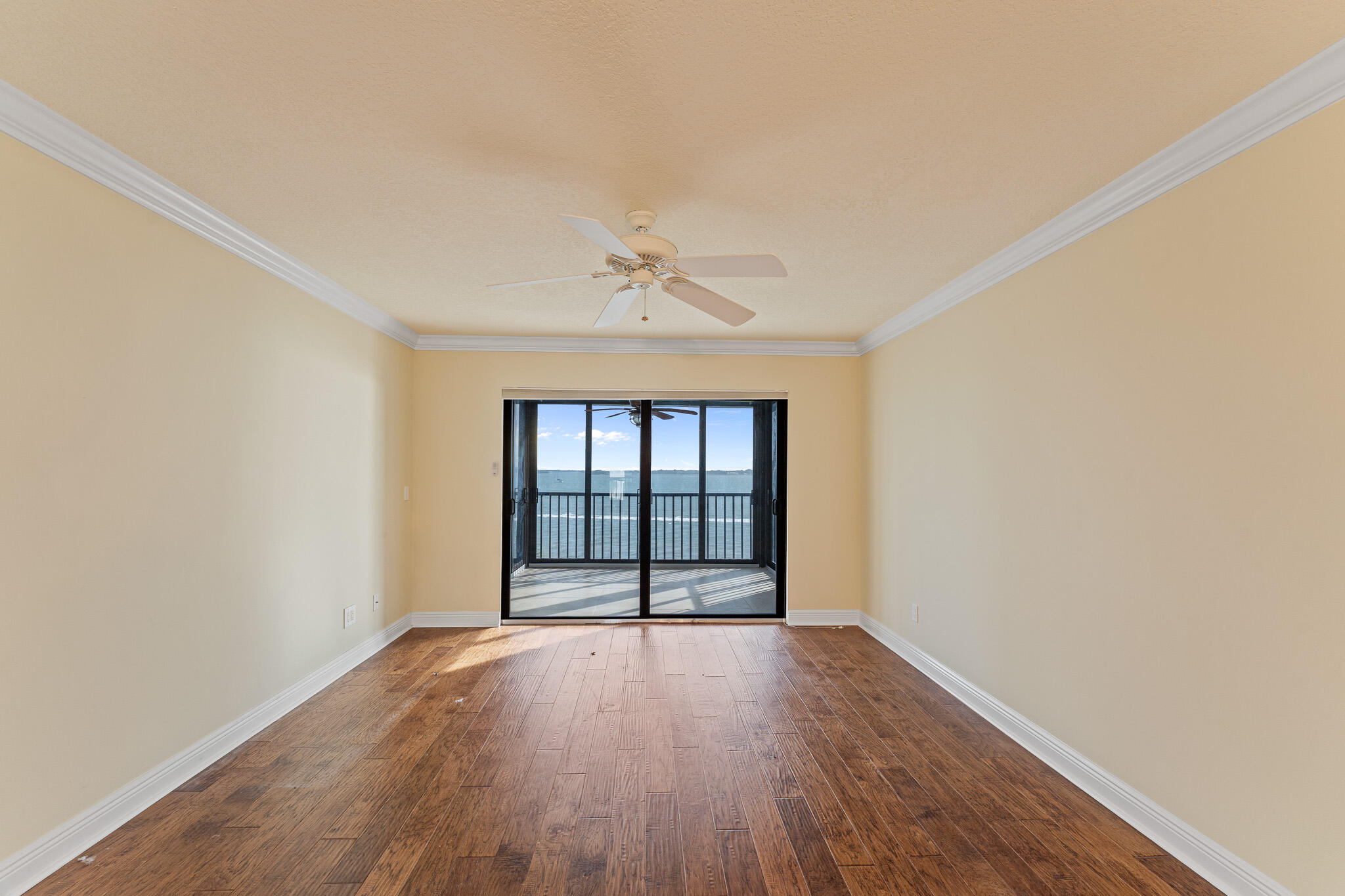 10 Northeast Plantation Road, Unit 305 Jensen Beach, FL 34957 - Photo 19 of 48 wooden floor in an empty room with a window