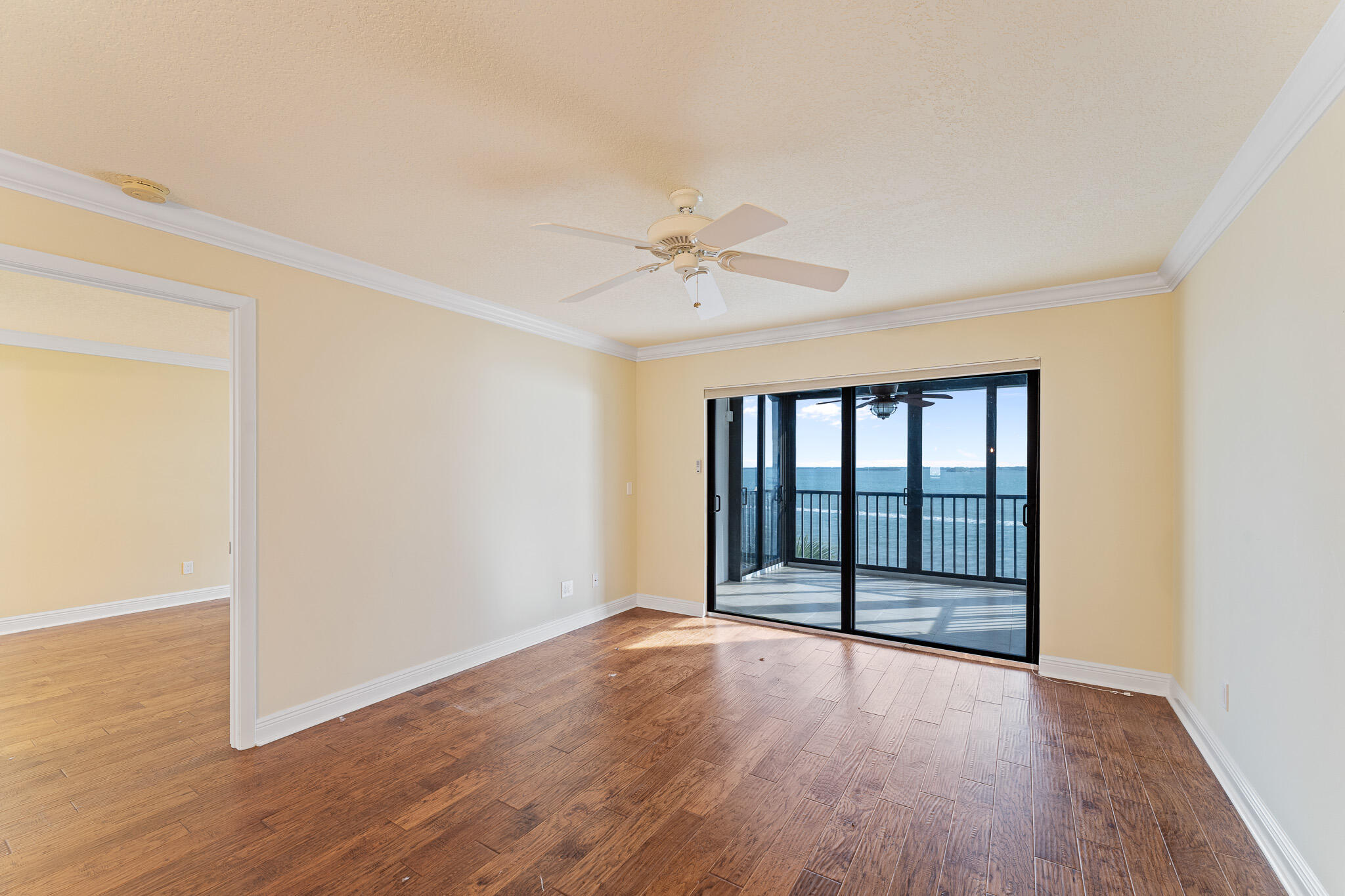 10 Northeast Plantation Road, Unit 305 Jensen Beach, FL 34957 - Photo 20 of 48 wooden floor in an empty room with a window