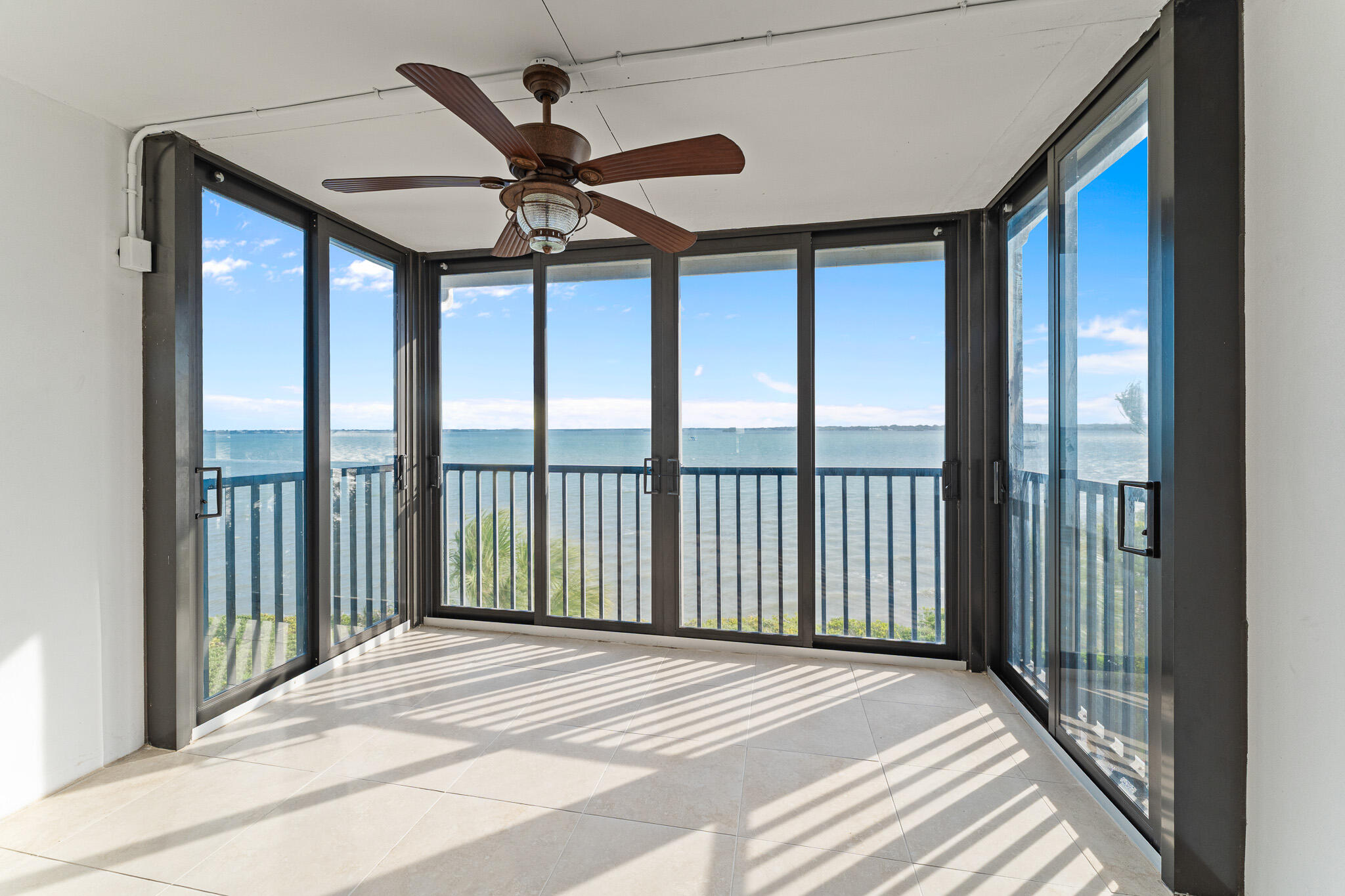 10 Northeast Plantation Road, Unit 305 Jensen Beach, FL 34957 - Photo 21 of 48 a view of a balcony from a ceiling fan