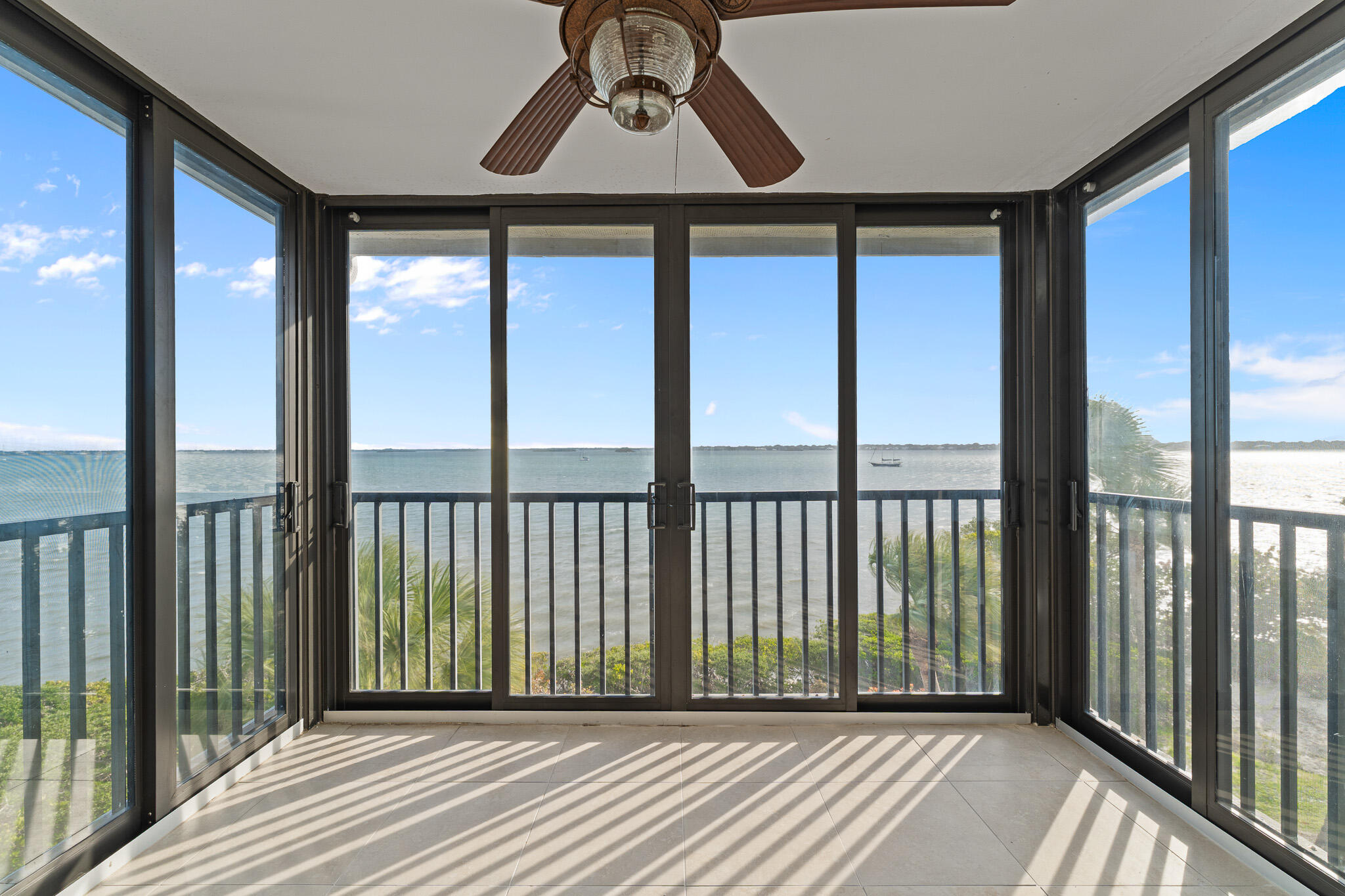 10 Northeast Plantation Road, Unit 305 Jensen Beach, FL 34957 - Photo 22 of 48 a view of a balcony with wooden floor