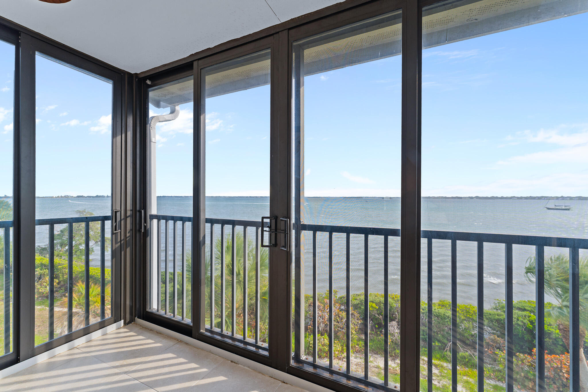 10 Northeast Plantation Road, Unit 305 Jensen Beach, FL 34957 - Photo 24 of 48 a view of a balcony with a floor to ceiling window