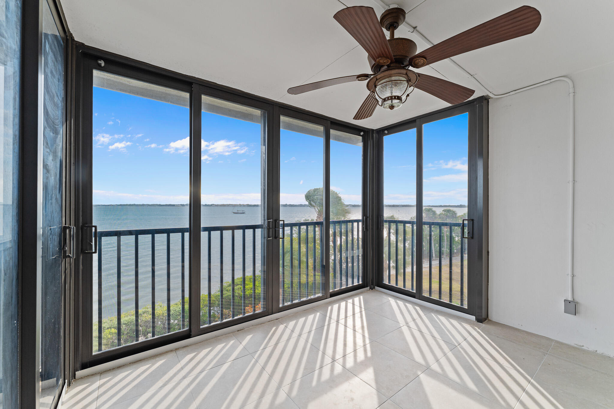 10 Northeast Plantation Road, Unit 305 Jensen Beach, FL 34957 - Photo 26 of 48 a view of a balcony with a chandelier