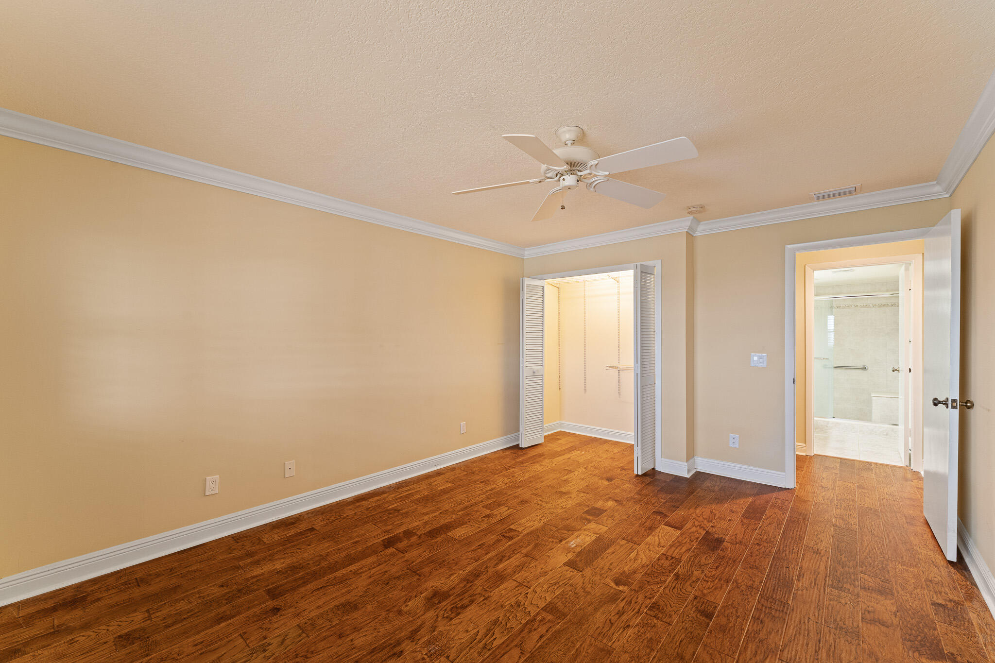 10 Northeast Plantation Road, Unit 305 Jensen Beach, FL 34957 - Photo 31 of 48 a view of an empty room with wooden floor