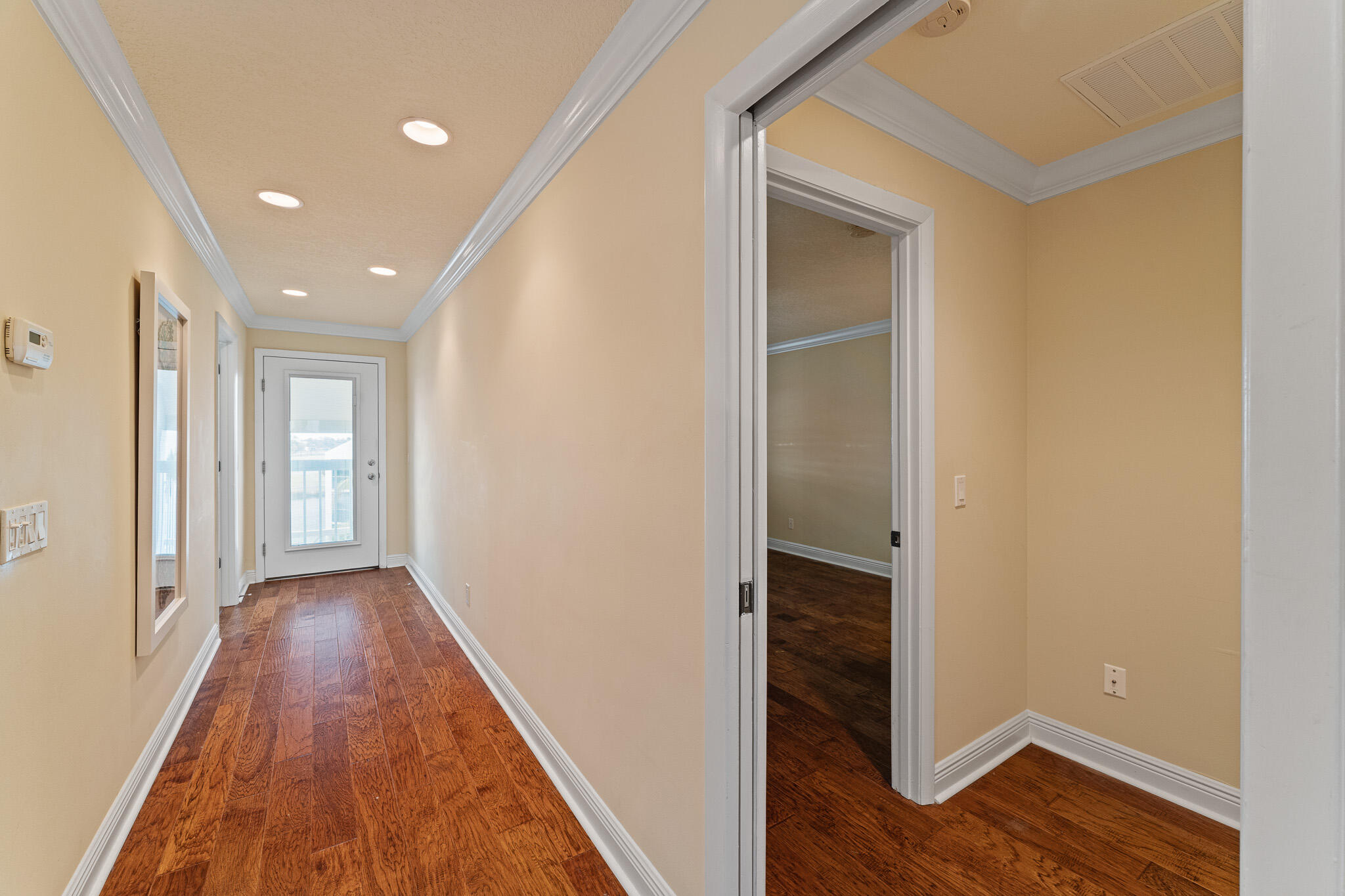10 Northeast Plantation Road, Unit 305 Jensen Beach, FL 34957 - Photo 38 of 48 a view of hallway with wooden floor