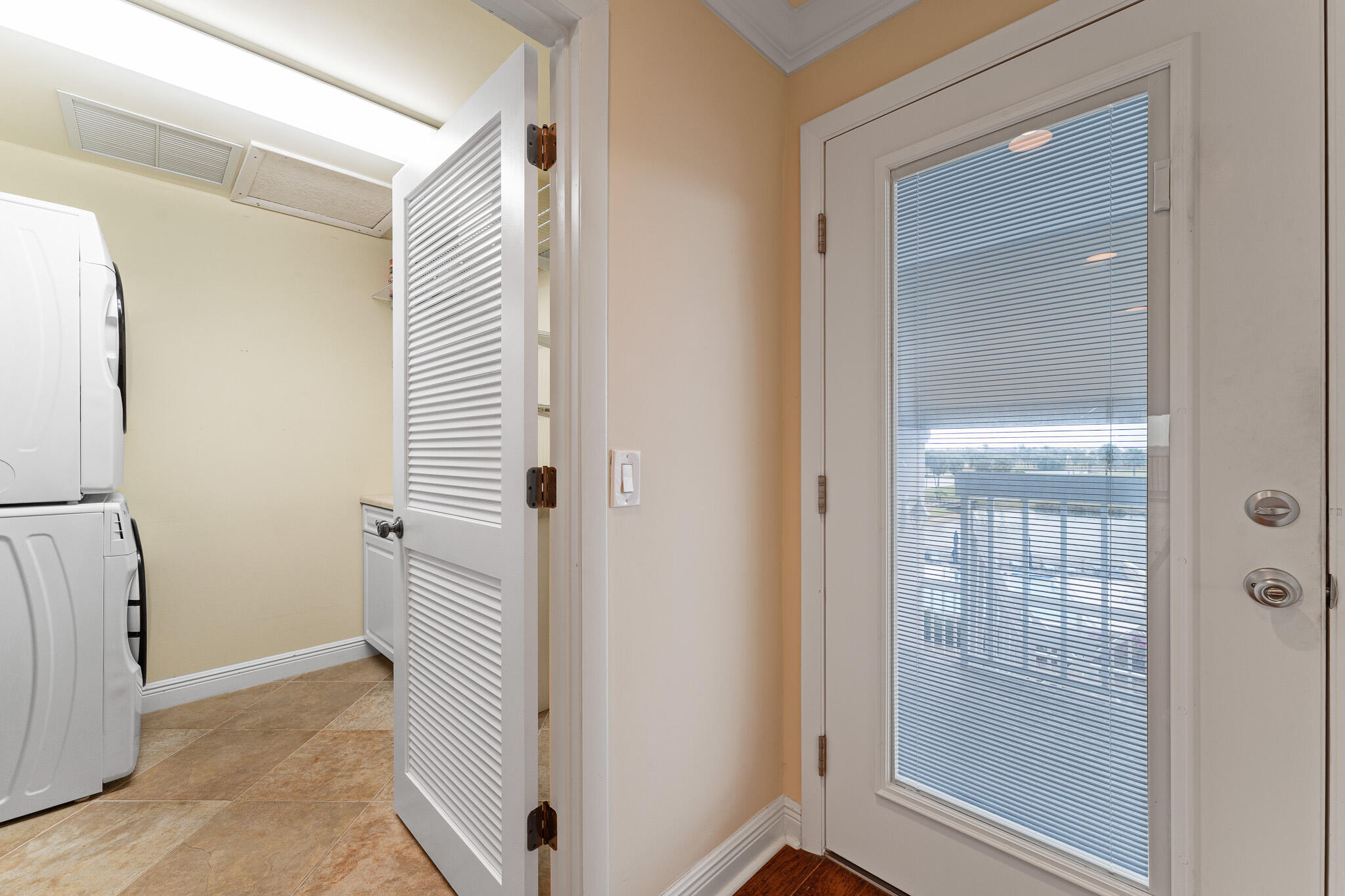 10 Northeast Plantation Road, Unit 305 Jensen Beach, FL 34957 - Photo 39 of 48 a view of a bathroom from a hallway