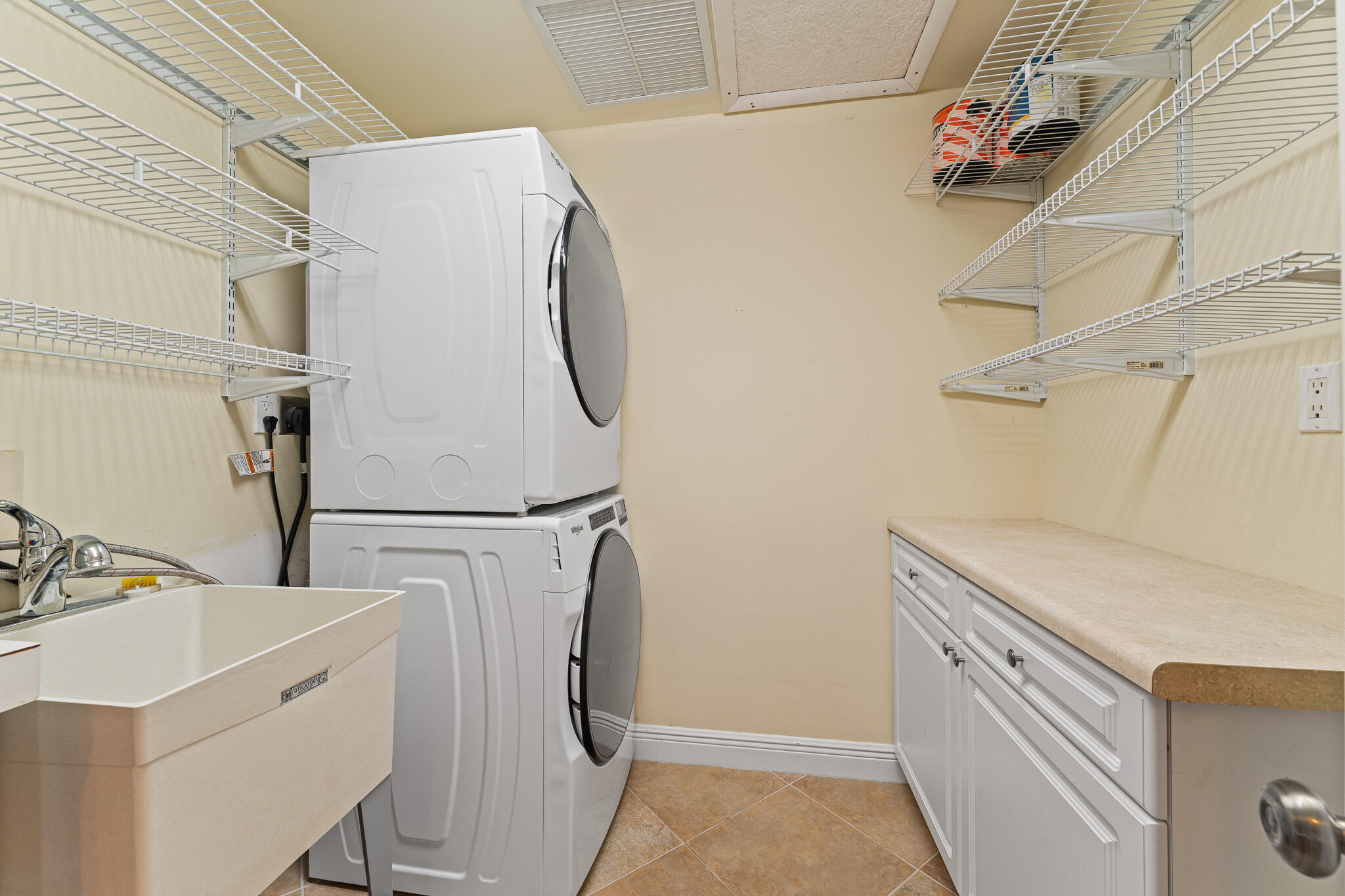 10 Northeast Plantation Road, Unit 305 Jensen Beach, FL 34957 - Photo 40 of 48 a utility room with dryer and washer
