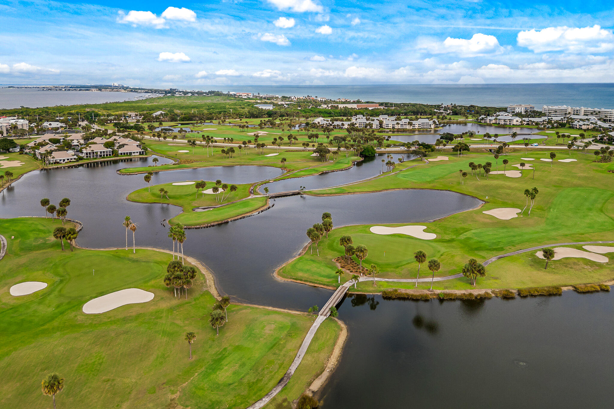 10 Northeast Plantation Road, Unit 305 Jensen Beach, FL 34957 - Photo 42 of 48 an aerial view of a house with a swimming pool