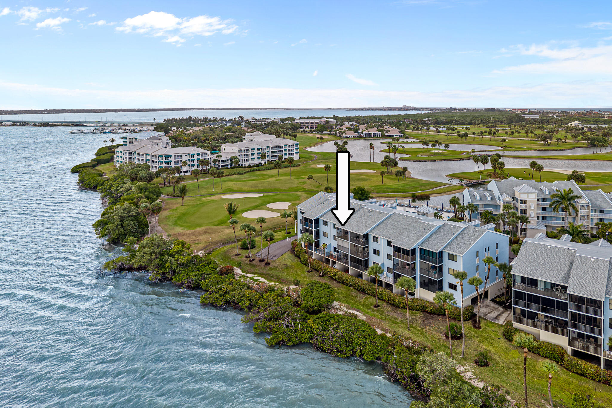 10 Northeast Plantation Road, Unit 305 Jensen Beach, FL 34957 - Photo 6 of 48 an aerial view of a house with a lake view