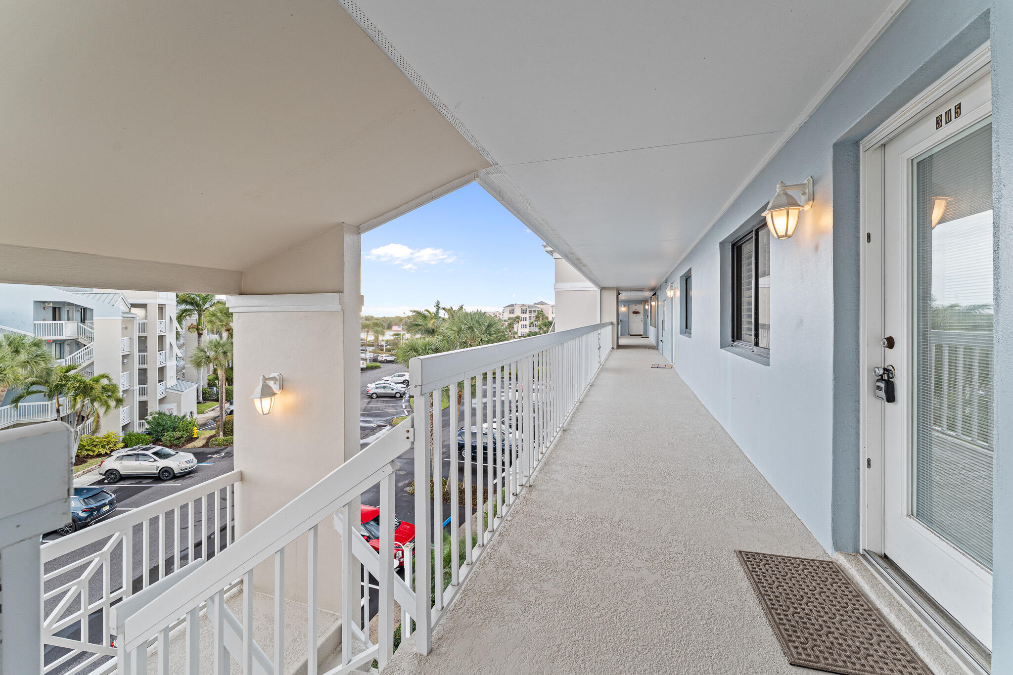 10 Northeast Plantation Road, Unit 305 Jensen Beach, FL 34957 - Photo 7 of 48 a view of an entryway with wooden floor