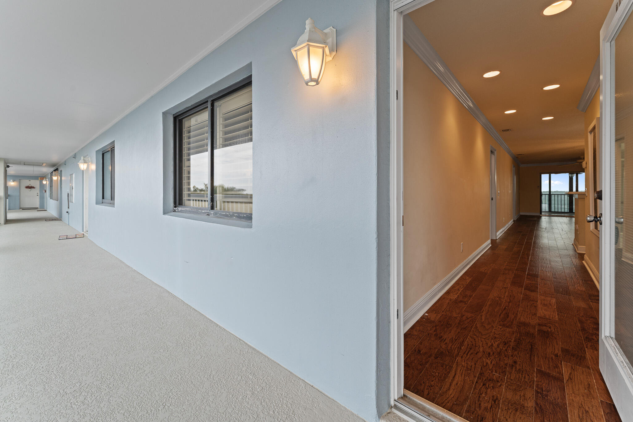 10 Northeast Plantation Road, Unit 305 Jensen Beach, FL 34957 - Photo 9 of 48 a view of a hallway with wooden floor and stairs