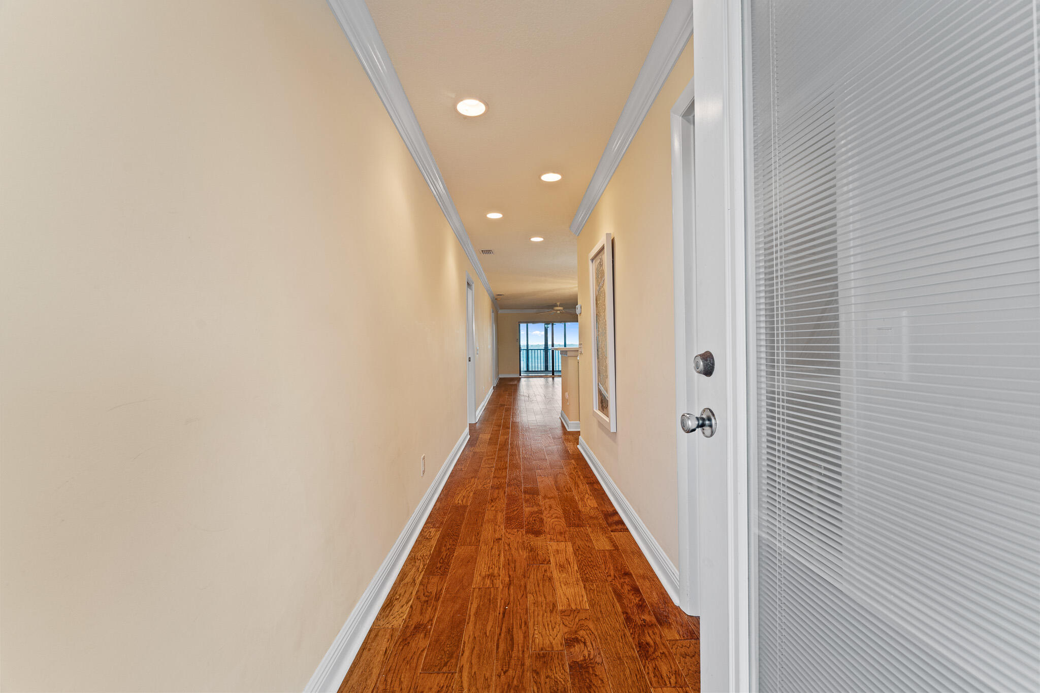 10 Northeast Plantation Road, Unit 305 Jensen Beach, FL 34957 - Photo 10 of 48 a view of a hallway with wooden floor