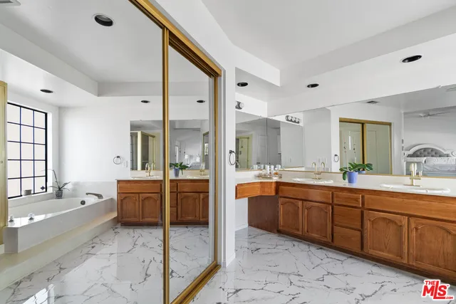a bathroom with a bathtub and a shower