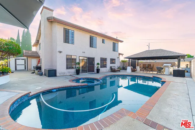 a patio with a table and chairs