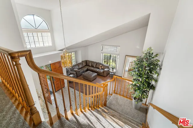 a spacious bedroom with a bed and a cabinets