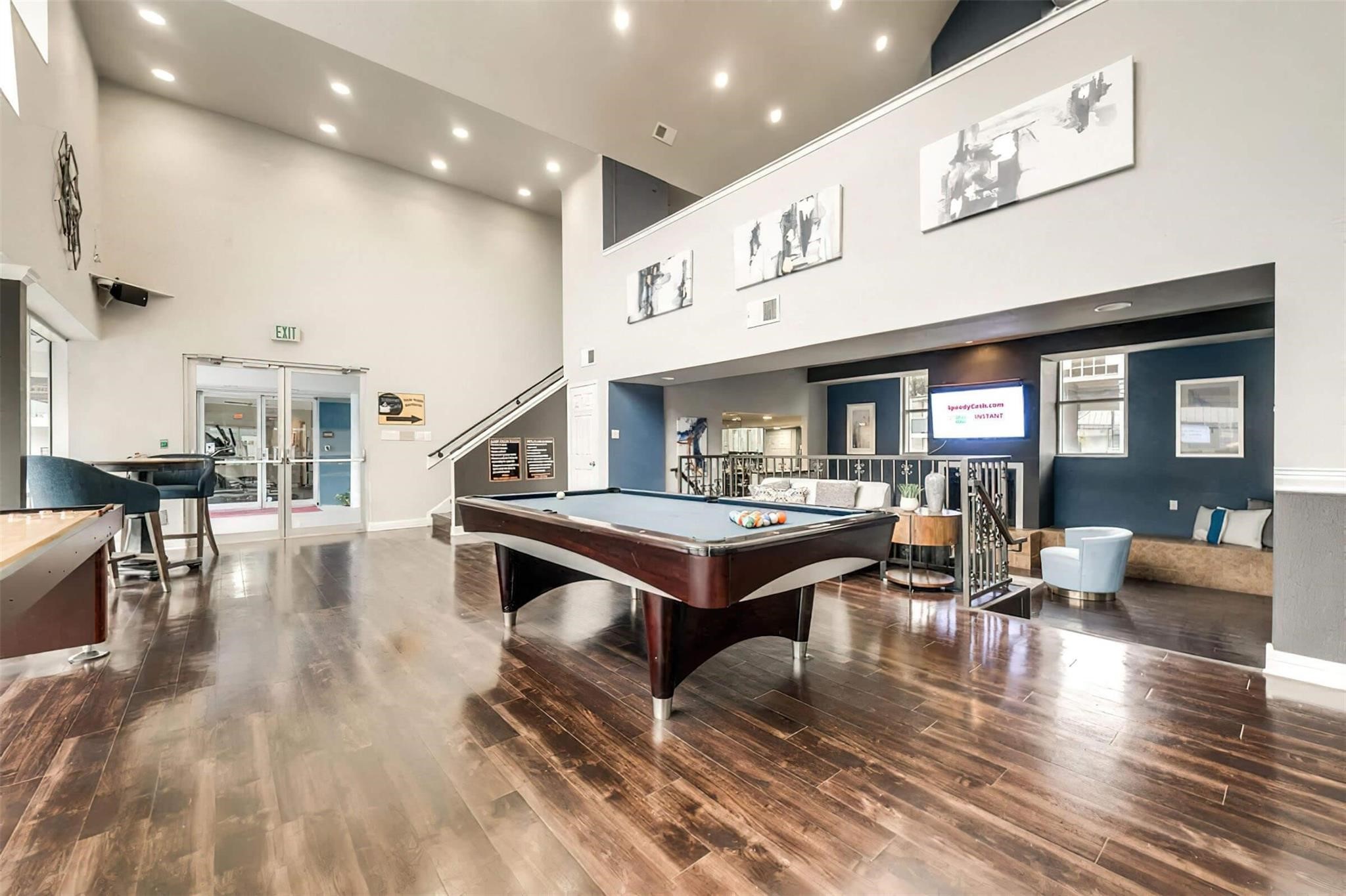 8162 Richmond Avenue, Unit 506 Houston, TX 77063 - Photo 20 of 33 a living room with furniture a table and kitchen view