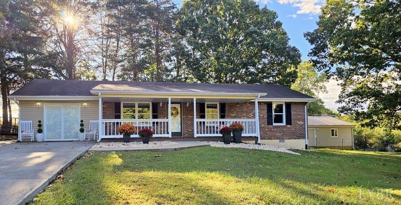 102 Ridgeview Road Hurt, VA 24563 - Photo 1 of 41 a view of a house with a swimming pool and a large tree