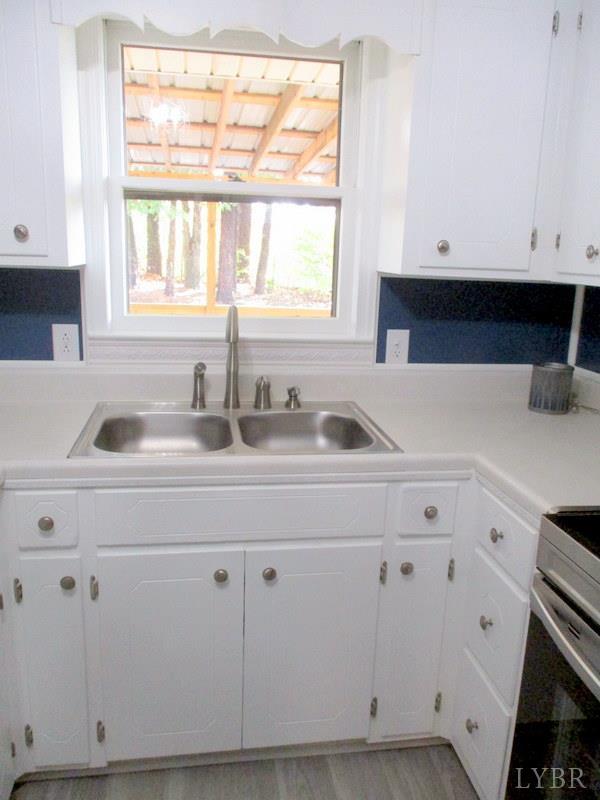 102 Ridgeview Road Hurt, VA 24563 - Photo 12 of 41 a kitchen with appliances a sink and a window