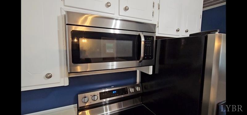 102 Ridgeview Road Hurt, VA 24563 - Photo 14 of 41 a kitchen with stainless steel appliances a microwave and a refrigerator