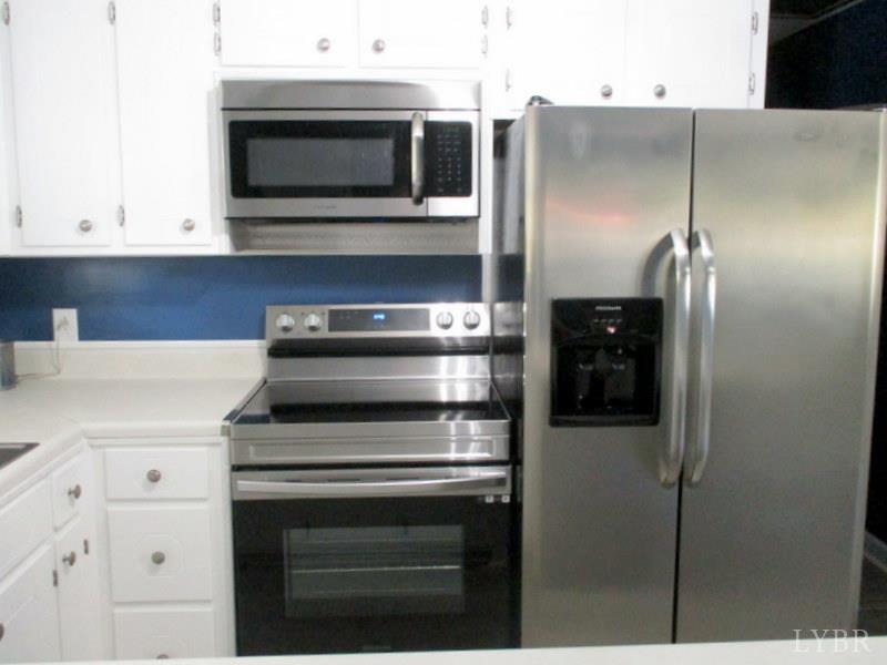 102 Ridgeview Road Hurt, VA 24563 - Photo 15 of 41 a kitchen with a stove and a microwave