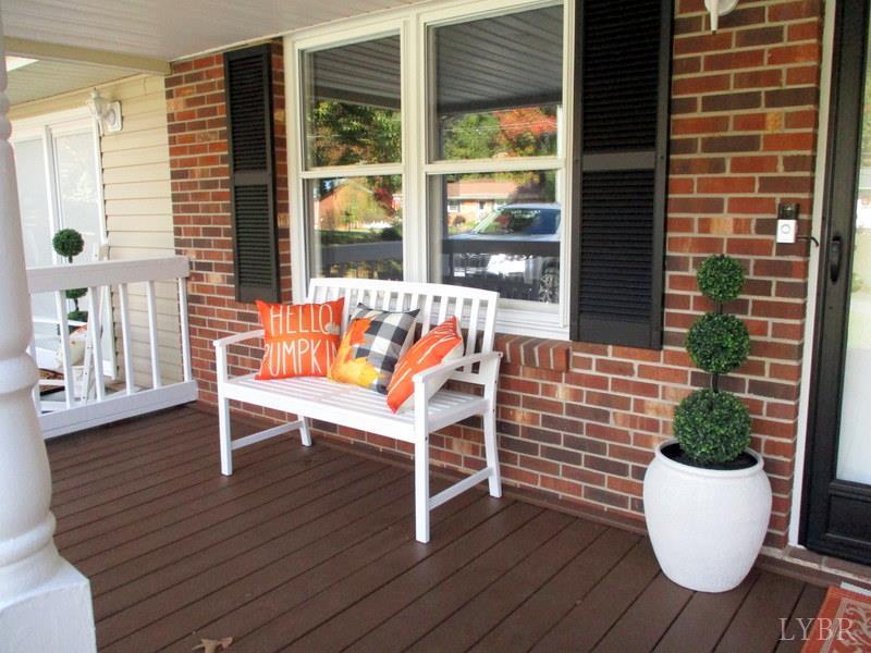 102 Ridgeview Road Hurt, VA 24563 - Photo 3 of 41 a wooden bench sitting in front of a building