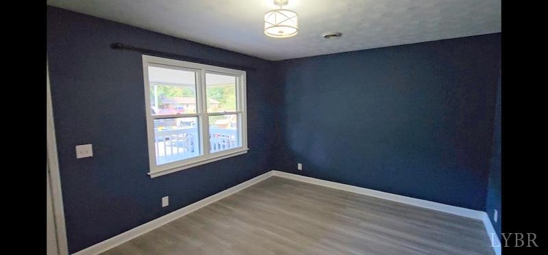 102 Ridgeview Road Hurt, VA 24563 - Photo 7 of 41 a view of empty room with wooden floor and fan