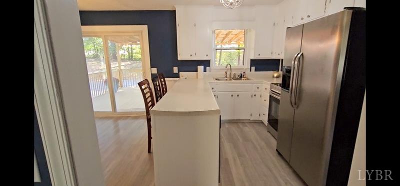 102 Ridgeview Road Hurt, VA 24563 - Photo 9 of 41 a kitchen with stainless steel appliances a refrigerator sink and cabinets