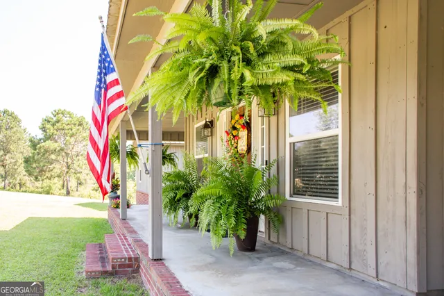 a view of a swimming pool with a lounge chair
