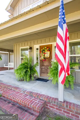 a kitchen with stainless steel appliances granite countertop a refrigerator a stove a sink and a microwave