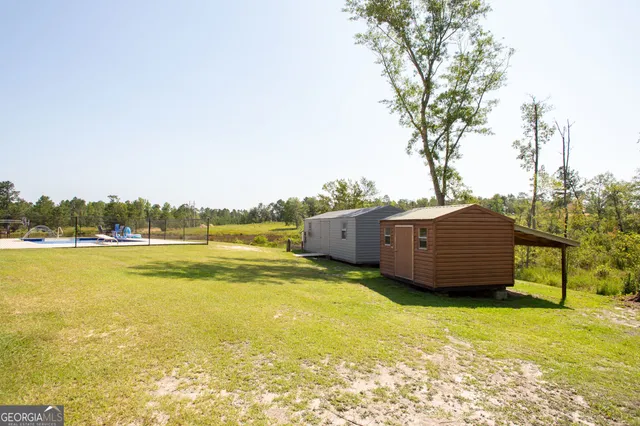 a view of a kitchen with fridge and rack