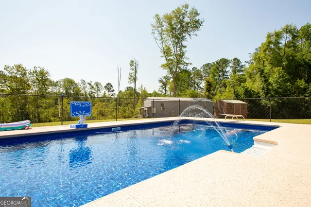 a view of a livingroom with furniture and windows