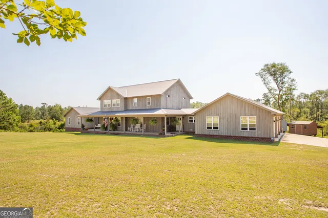 a front view of a house with fountain