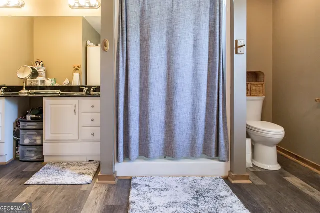 a utility room with sink dryer and washer
