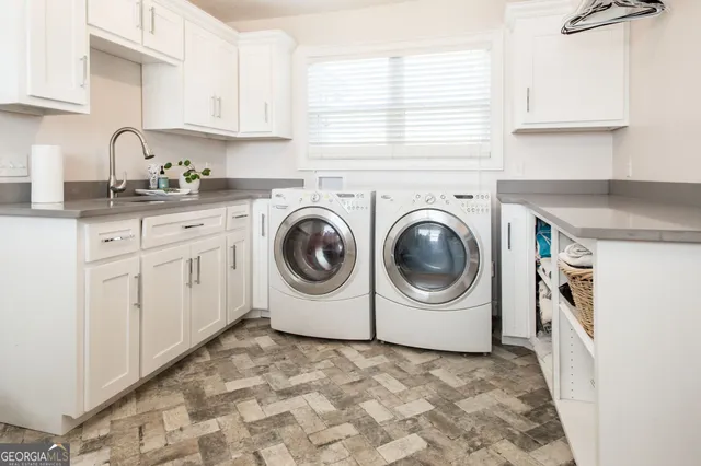 a living room with furniture a ceiling fan and a rug