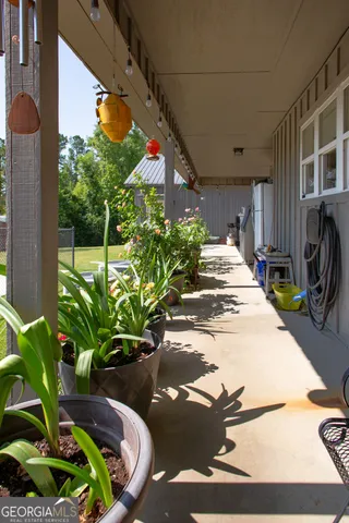 a backyard of a house with a table and chair