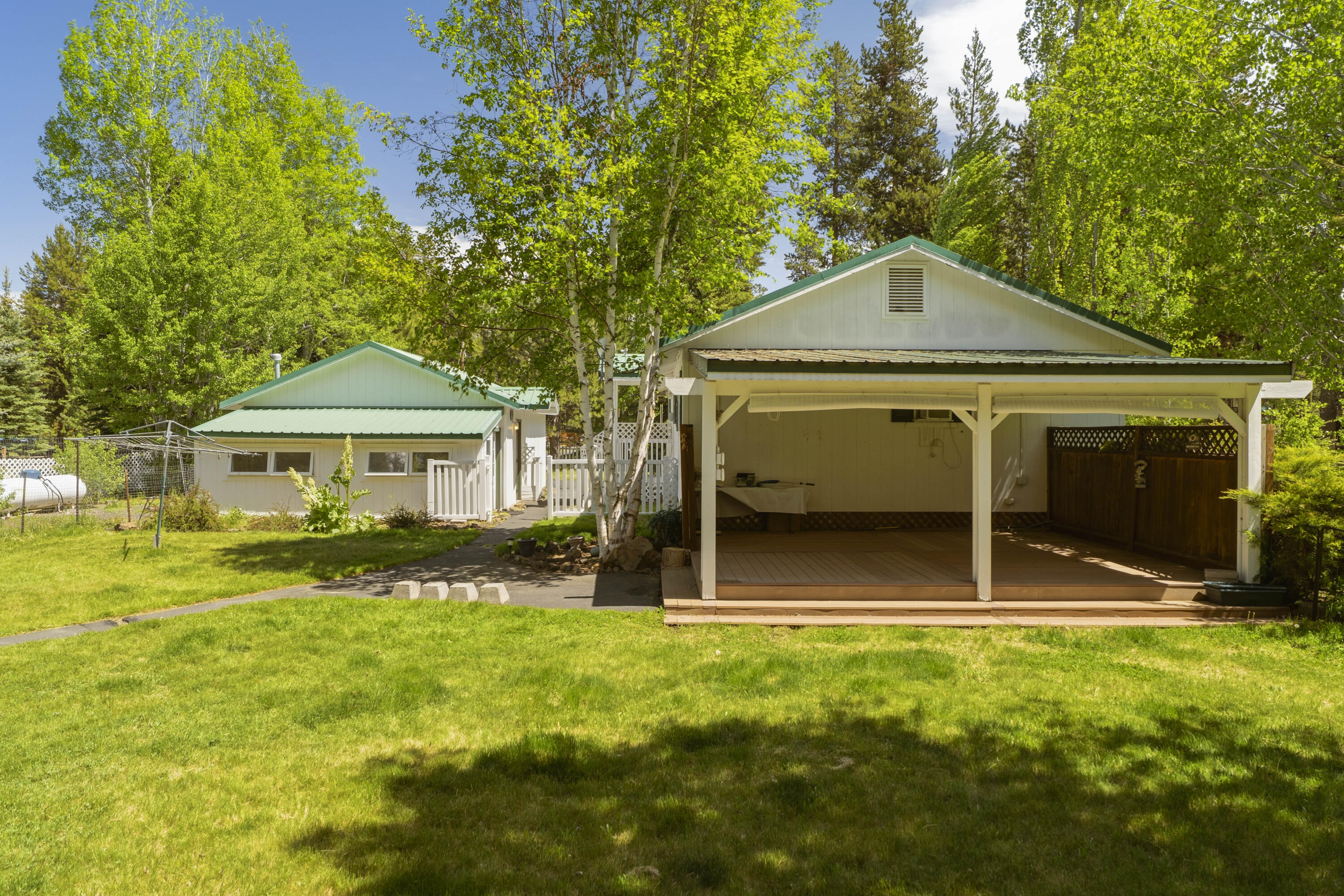55885 Osprey Road Bend, OR 97707 - Photo 46 of 58 Covered back porch from yard view.