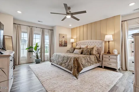 a very nice looking open dining room with kitchen island furniture a large window and kitchen view