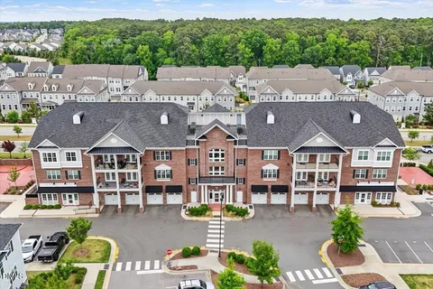 an aerial view of a house with garden space lake view and mountain view