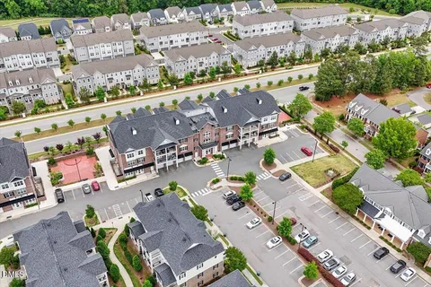 an aerial view of a house with a lake view