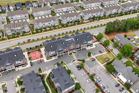 an aerial view of a house with a garden