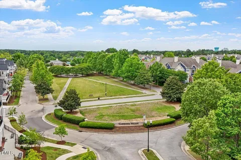 an aerial view of a house with outdoor space