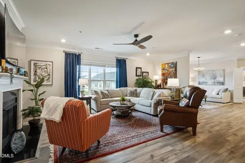 a living room with furniture fireplace and flat screen
