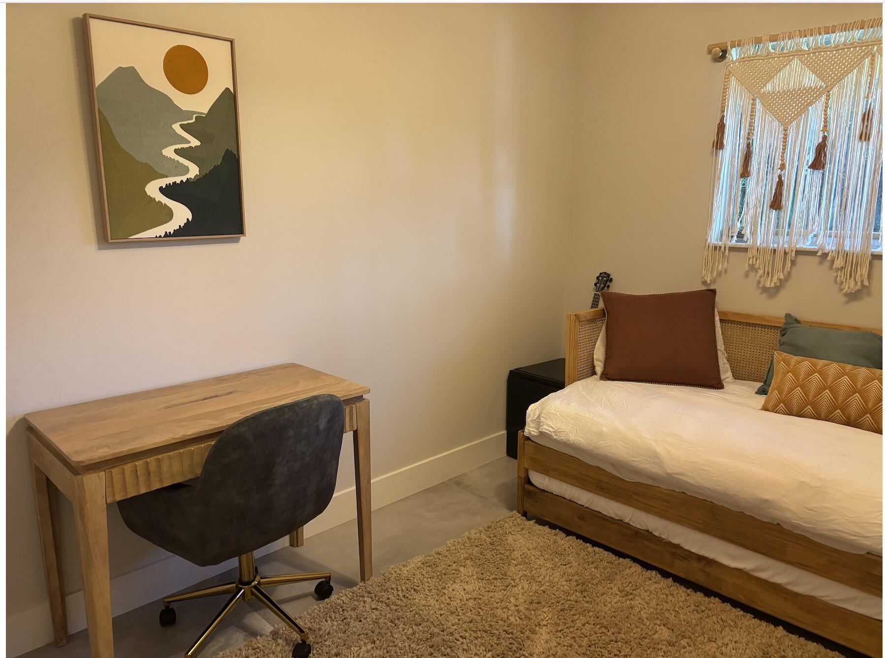 1822 Windsor Drive, Unit 1 Juno Ridge, FL 33408 - Photo 12 of 12 a bedroom with a bed and chair
