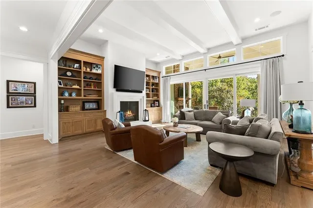 a bathroom with a granite countertop sink a toilet and a mirror