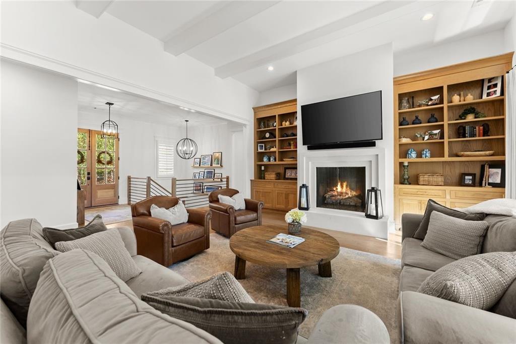 3116 Winding Lake Court Gainesville, GA 30504 - Photo 14 of 94 a living room with furniture fireplace and a flat screen tv