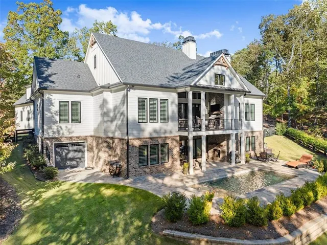 a front view of a house with a yard table and chairs