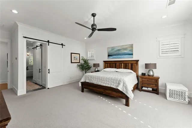 a bedroom with a bed and a television